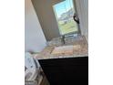 Modern bathroom with granite countertop, single sink, and toilet at 510 Overlook Rd, Covington, GA 30014