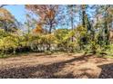 Spacious backyard surrounded by mature trees at 231 Glenrose Sw Cir, Atlanta, GA 30354