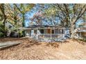 Ranch style home with front porch and mature trees at 231 Glenrose Sw Cir, Atlanta, GA 30354