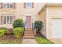 Front entrance with brick steps and landscaping at 3390 Northcliff Dr, Suwanee, GA 30024