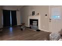 Living room with fireplace and wood-look flooring at 347 Waits Sw Dr, Atlanta, GA 30331