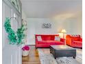 Cozy living room featuring red couches and a dark brown ottoman at 5592 Brady Dr, Stone Mountain, GA 30087