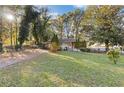 Brick ranch house with a large front yard and mature trees at 2081 Dodson Sw Dr, Atlanta, GA 30311
