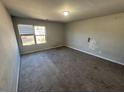 Empty bedroom with carpeted floor and a window at 2754 Topaz Rd, Riverdale, GA 30296