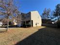 Side view of two-story house with yard and fence at 2754 Topaz Rd, Riverdale, GA 30296