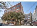 Brick building with trees and parking in front at 426 Marietta Nw St # 410, Atlanta, GA 30313
