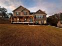 Two-story house with a large backyard and surrounding trees at 508 Grace Ct, Temple, GA 30179