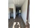 Bright entry hall with wood-look floors and views into the kitchen and living areas at 504 Overlook Rd, Covington, GA 30052