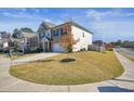 Two-story home with a side view showcasing the home's landscaping and neighborhood at 104 Avery Landing Way, Canton, GA 30115