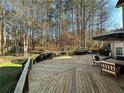 Spacious deck with wooded backyard views at 1025 Charleston Trce, Roswell, GA 30075