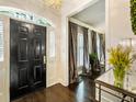 Elegant entryway with black door and hardwood floors at 20 Pointe Se Ter, Atlanta, GA 30339