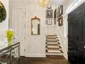 Bright entryway with staircase, mirror, and gallery wall at 20 Pointe Se Ter, Atlanta, GA 30339