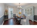 Bright dining room with hardwood floors and a built-in hutch at 4663 Brazil Wood Nw Dr, Kennesaw, GA 30144