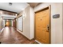 Apartment hallway with tile floors and a door at 390 17Th Nw St # 4003, Atlanta, GA 30363