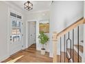 Bright and spacious entryway with hardwood floors and staircase at 108 Cottage Gate Ln, Roswell, GA 30076
