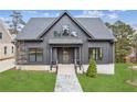 Gray farmhouse exterior with a stone path and lush green lawn at 108 Cottage Gate Ln, Roswell, GA 30076