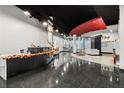 Modern building lobby with a reception desk and seating at 115 W Peachtree Nw Pl # 411, Atlanta, GA 30313