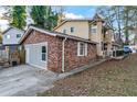 Attached brick garage with extra parking space at 3189 Bellgreen Way, Decatur, GA 30032