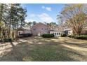 Brick home with large backyard and patio at 1397 Squire Ln, Cumming, GA 30041