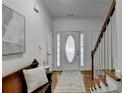 Bright and airy entryway with hardwood floors and bench at 2075 Pine Tree Dr # A4, Buford, GA 30518