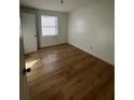 Simple bedroom with light wood-look flooring and a window at 1777 Cahoon Sw St, Atlanta, GA 30310