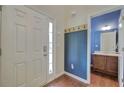 Entryway with coat hooks, powder room, and hardwood flooring at 138 Gorham Gates Dr, Hiram, GA 30141
