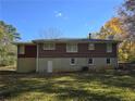 Side view of brick ranch house showing additional backyard space at 5910 Lakeshore Se Dr, Mableton, GA 30126