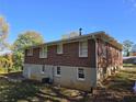 Side view of brick ranch house, showcasing the back at 5910 Lakeshore Se Dr, Mableton, GA 30126