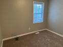 Simple bedroom with carpeted floor and window at 3506 Ten Oaks Ct, Powder Springs, GA 30127