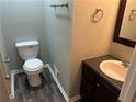Small half bathroom with toilet and sink at 3506 Ten Oaks Ct, Powder Springs, GA 30127