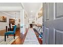 Bright and spacious entryway with hardwood floors and views into the dining and living rooms at 2599 Windsor Knoll Dr, Dacula, GA 30019