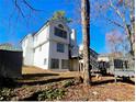 Rear view of house showing deck and additional storage at 1445 Watercrest Cir, Lawrenceville, GA 30043