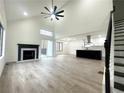 Open living room showcasing a fireplace and kitchen views at 1445 Watercrest Cir, Lawrenceville, GA 30043