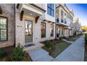 Townhouse entrance with landscaping and sidewalk at 280 Briscoe Way # 38, Alpharetta, GA 30009