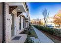 Townhouse street view with landscaping and sidewalk at 280 Briscoe Way # 38, Alpharetta, GA 30009