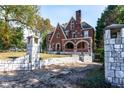 Brick home with stone pillars and a long driveway at 1225 Clifton Rd, Atlanta, GA 30307