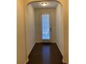 Bright entryway with hardwood floors and door to outside at 5671 Radford Loop, Fairburn, GA 30213