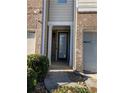 Front entry with brick and neutral siding at 5671 Radford Loop, Fairburn, GA 30213