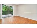 Simple dining room with hardwood floors and sliding glass doors to a deck at 2940 Leah Ln, Douglasville, GA 30135