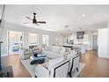 Spacious living area showcasing an open floor plan with kitchen access and balcony views at 152 Grand Cres, Alpharetta, GA 30009