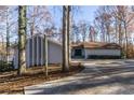 White house exterior with a long driveway at 510 Pine Lake Dr, Cumming, GA 30040