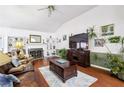 Living area with vaulted ceiling, fireplace, and built-in shelves at 1690 Henderson Way, Lawrenceville, GA 30043