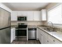 Modern kitchen with stainless steel appliances and granite countertops at 1777 W Austin Rd, Decatur, GA 30032