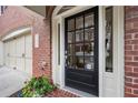 Elegant black front door with glass panels and welcoming entryway at 2252 Edgartown Se Ln # 2, Smyrna, GA 30080