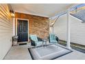 Covered porch with stone wall and seating area at 2675 Gateview Ct, Cumming, GA 30040