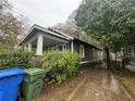 Home's side view showcasing a driveway and landscaping at 603 Willard Sw Ave, Atlanta, GA 30310