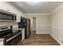 Modern kitchen with stainless steel appliances and granite countertops at 2363 Dabney Ter, Atlanta, GA 30344