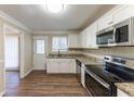 Updated kitchen featuring granite countertops and stainless steel appliances at 2363 Dabney Ter, Atlanta, GA 30344