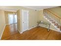 Bright living room with hardwood floors and view of dining area at 6940 Roswell Rd # C14, Atlanta, GA 30328