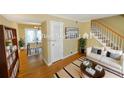 Virtually staged living room with hardwood floors and modern furniture at 6940 Roswell Rd # C14, Atlanta, GA 30328
